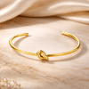 Anna K Jewelry - Armband Endless Knot Bangle Guld